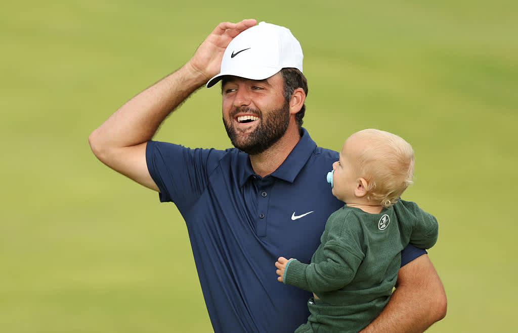 PORTRUSH, NORTHERN IRELAND - JULY 20: Scottie Scheffler of the United States celebrates with his son Bennett Scheffler on the 18th green after winning The 153rd Open Championship at Royal Portrush Golf Club on July 20, 2025 in Portrush, Northern Ireland. (Photo by Luke Walker/Getty Images for HSBC)