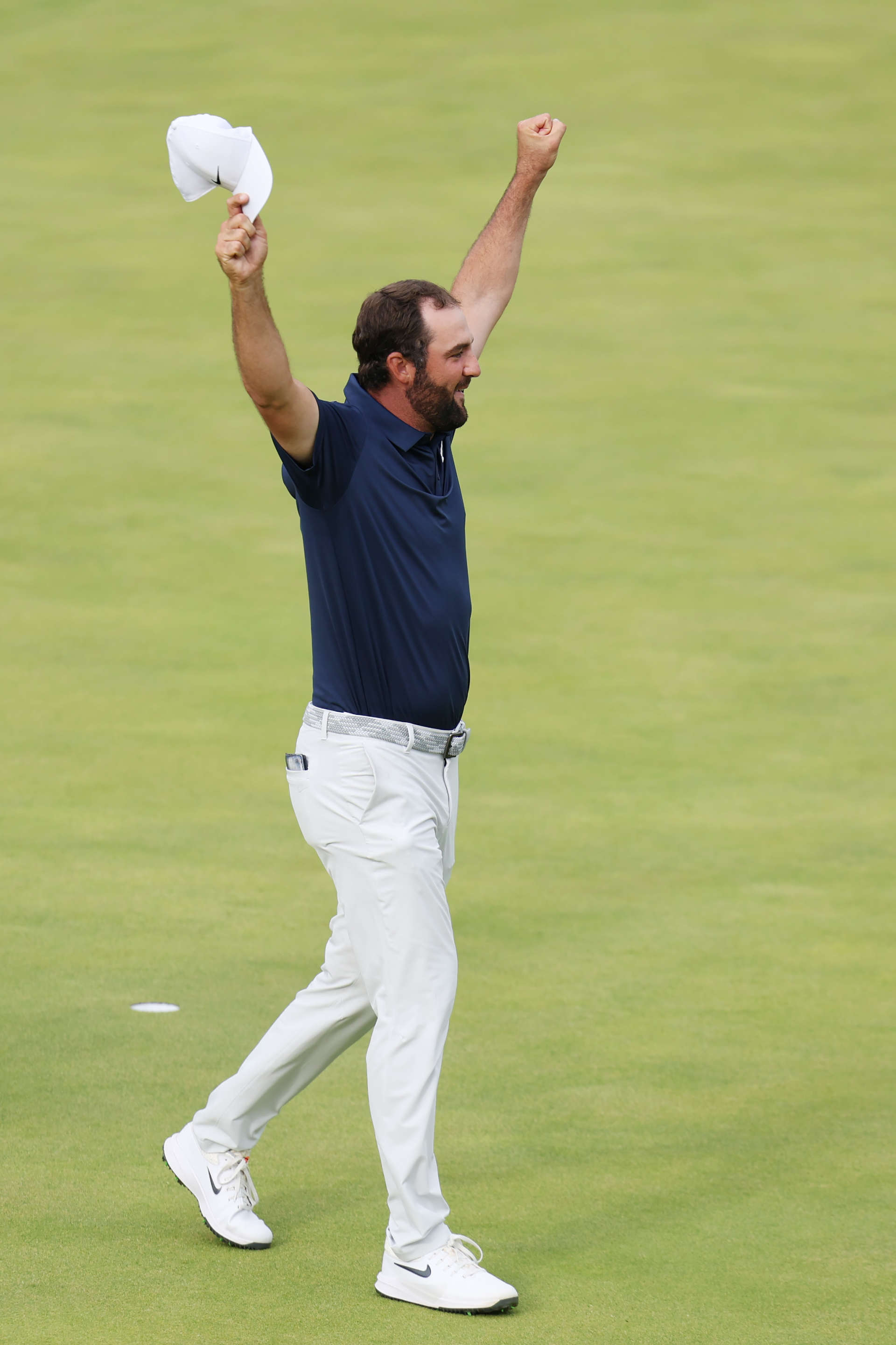 PORTRUSH, NORTHERN IRELAND - JULY 20: Scottie Scheffler of the United States celebrates on the 18th green after winning The 153rd Open Championship at Royal Portrush Golf Club on July 20, 2025 in Portrush, Northern Ireland. (Photo by Andrew Redington/Getty Images)