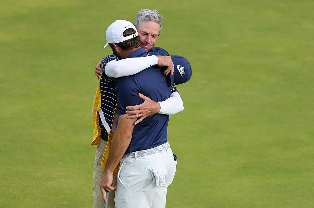 PORTRUSH, NORTHERN IRELAND - JULY 20: Scottie Scheffler of the United States celebrates with his caddie Ted Scott on the 18th green after winning The 153rd Open Championship at Royal Portrush Golf Club on July 20, 2025 in Portrush, Northern Ireland. (Photo by Alex Slitz/Getty Images)