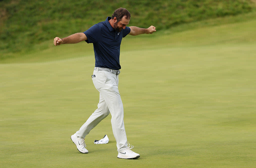 PORTRUSH, NORTHERN IRELAND - JULY 20: Scottie Scheffler of the United States celebrates on the 18th green after winning The 153rd Open Championship at Royal Portrush Golf Club on July 20, 2025 in Portrush, Northern Ireland. (Photo by Richard Heathcote/Getty Images)