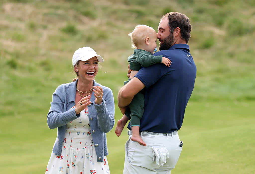 PORTRUSH, NORTHERN IRELAND - JULY 20: Scottie Scheffler of the United States celebrates with his wife Meredith Scheffler and son Bennett Scheffler on the 18th green after winning The 153rd Open Championship at Royal Portrush Golf Club on July 20, 2025 in Portrush, Northern Ireland. (Photo by Warren Little/Getty Images)