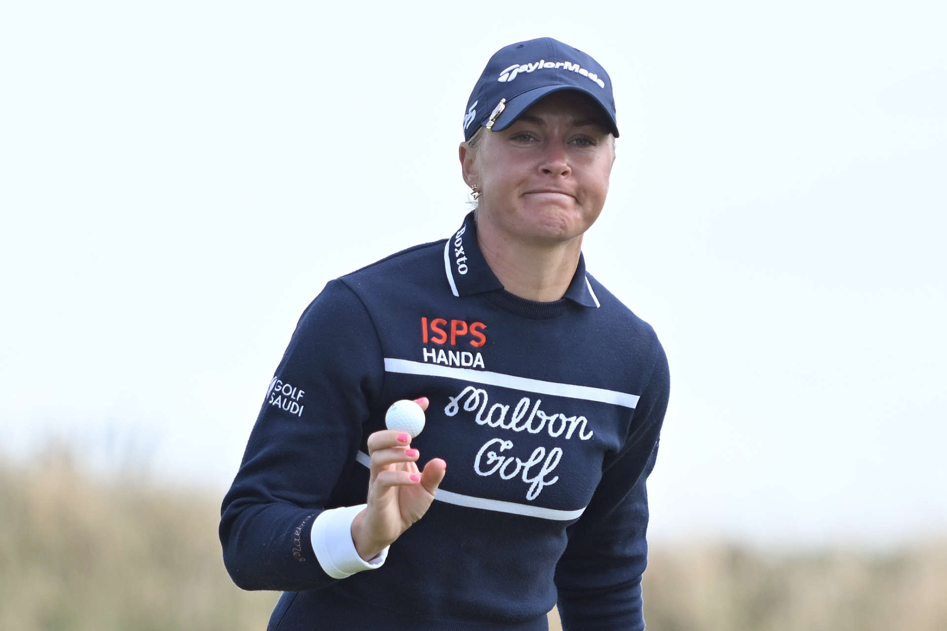 TROON, SCOTLAND - AUGUST 18: Charley Hull of England acknowledge the crowd after putting on the 10th green during the final round of the ISPS HANDA Women's Scottish Open at Dundonald Links Golf Course on August 18, 2024 in Troon, Scotland. (Photo by Paul Devlin/Getty Images)