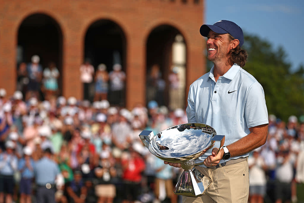 ATLANTA, GEORGIA - AUGUST 24: Tommy Fleetwood of England celebrates with the Fedex Cup trophy after winning the final round of the TOUR Championship 2025 at East Lake Golf Club on August 24, 2025 in Atlanta, Georgia. (Photo by Jared C. Tilton/Getty Images)