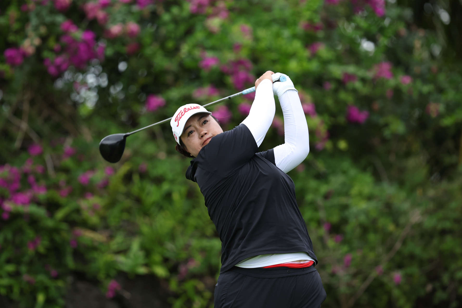 HAINAN ISLAND, CHINA - MARCH 08: Li Lu of China hits a tee shot on 14th hole during the second round of the Blue Bay LPGA at Jian Lake Blue Bay Golf Course on March 08, 2024 in Hainan Island, Hainan. (Photo by Zhizhao Wu/Getty Images)