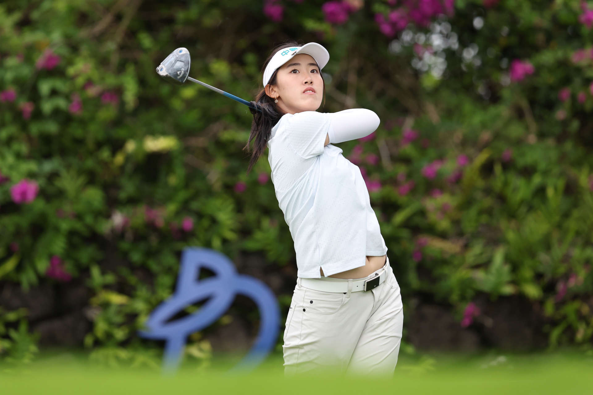 HAINAN ISLAND, CHINA - MARCH 08: Xiaowen Yin of China hits a tee shot on 14th hole during the second round of the Blue Bay LPGA at Jian Lake Blue Bay Golf Course on March 08, 2024 in Hainan Island, Hainan. (Photo by Zhizhao Wu/Getty Images)