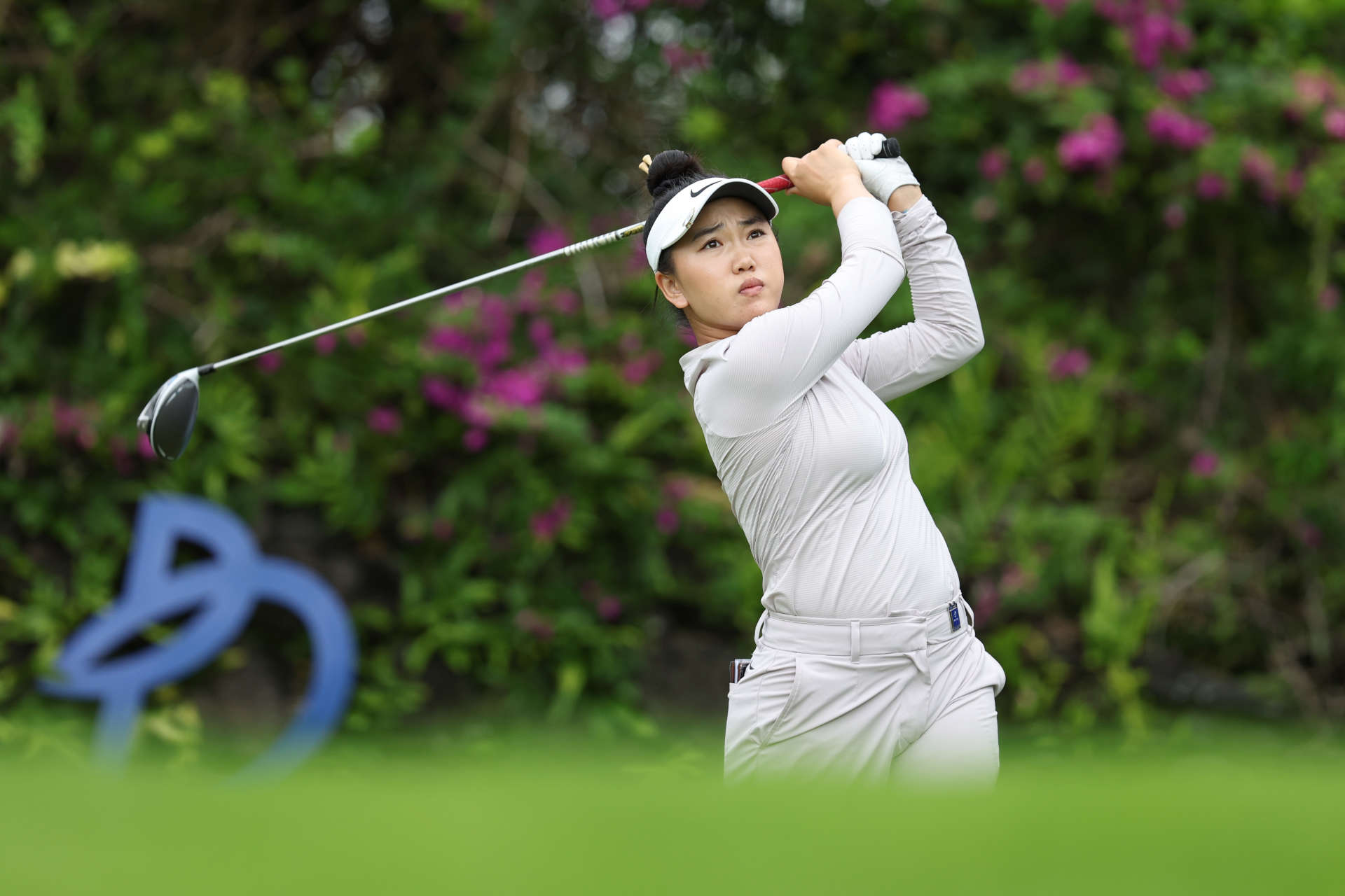 HAINAN ISLAND, CHINA - MARCH 08: Lucy Li of The United States hits a tee shot on 14th hole during the second round of the Blue Bay LPGA at Jian Lake Blue Bay Golf Course on March 08, 2024 in Hainan Island, Hainan. (Photo by Zhizhao Wu/Getty Images)