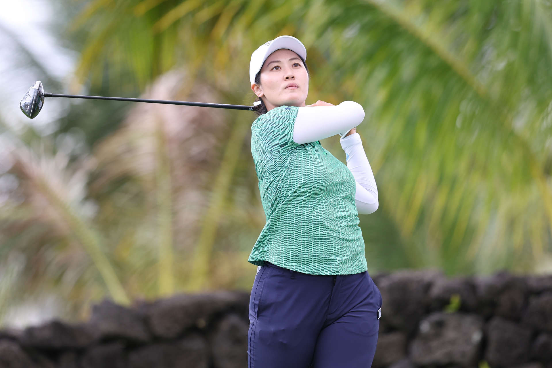 HAINAN ISLAND, CHINA - MARCH 08: Xiyu Janet Lin of China hits a tee shot on the 13th hole during the second round of the Blue Bay LPGA at Jian Lake Blue Bay Golf Course on March 08, 2024 in Hainan Island, Hainan. (Photo by Zhizhao Wu/Getty Images)