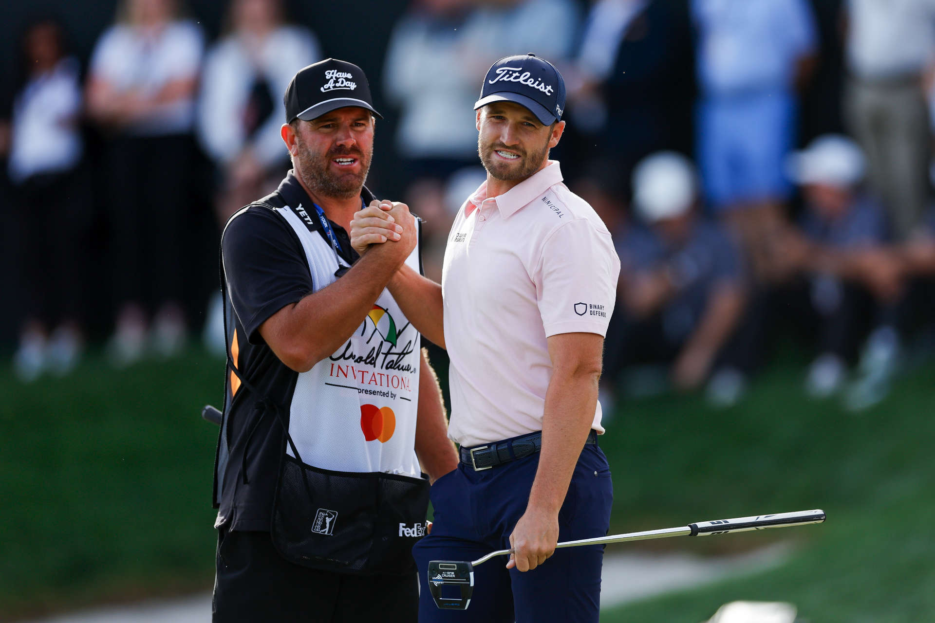 ORLANDO, FLORIDA - MARCH 10: Wyndham Clark of the United States and his caddie John Ellis celebrate after Clark made a birdie on the 18th hole during the final round of the Arnold Palmer Invitational presented by Mastercard at Arnold Palmer Bay Hill Golf Course on March 10, 2024 in Orlando, Florida. (Photo by Mike Ehrmann/Getty Images)