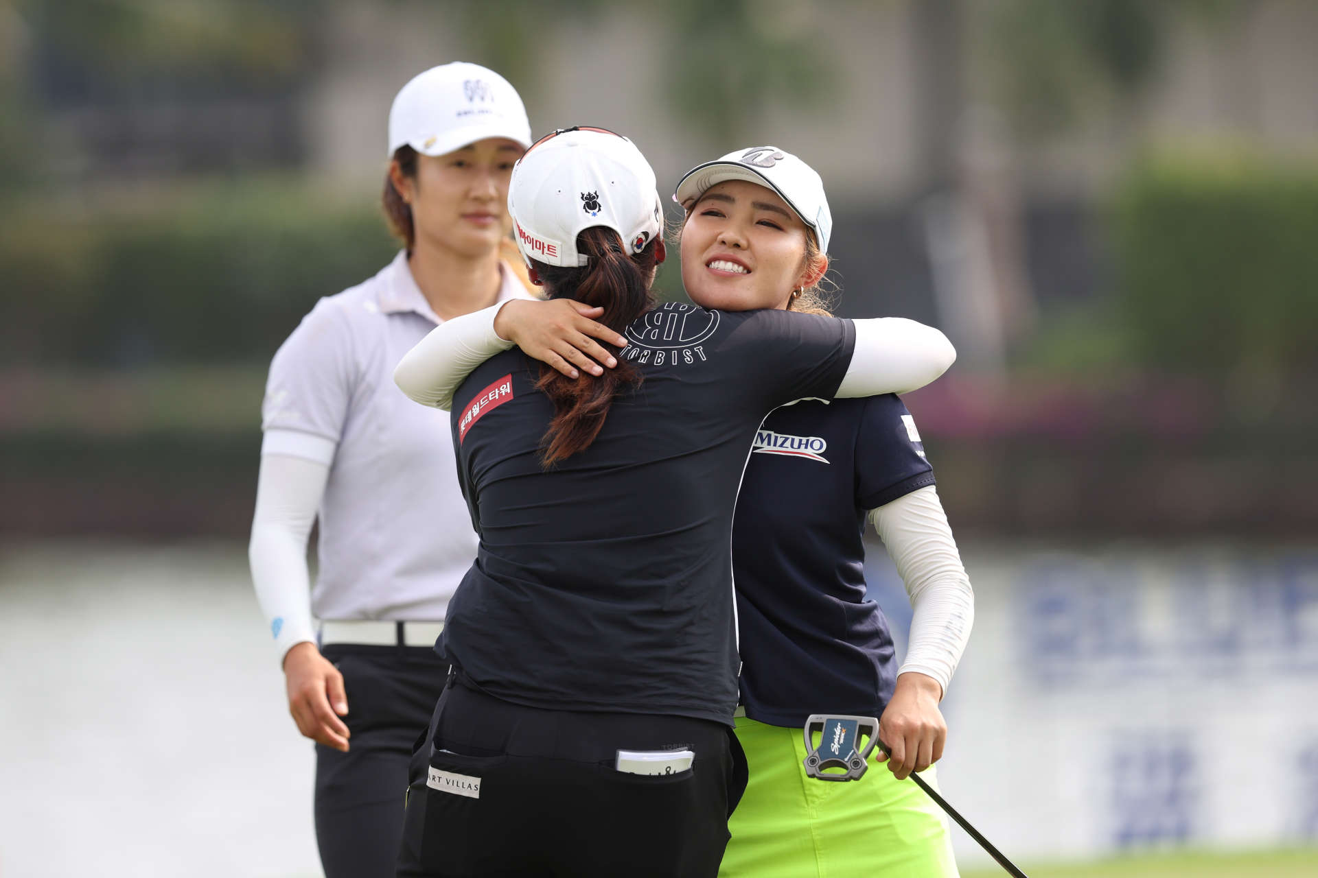 HAINAN ISLAND, CHINA - MARCH 10: Ayaka Furue of Japan hugs with Hye-Jin Choi of Republic of Korea on 18th hole during the final round of the Blue Bay LPGA at Jian Lake Blue Bay Golf Course on March 10, 2024 in Hainan Island, Hainan. (Photo by Zhizhao Wu/Getty Images)