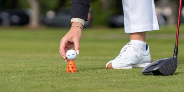This new golf tee sits on top of the ground rather than being pushed into it