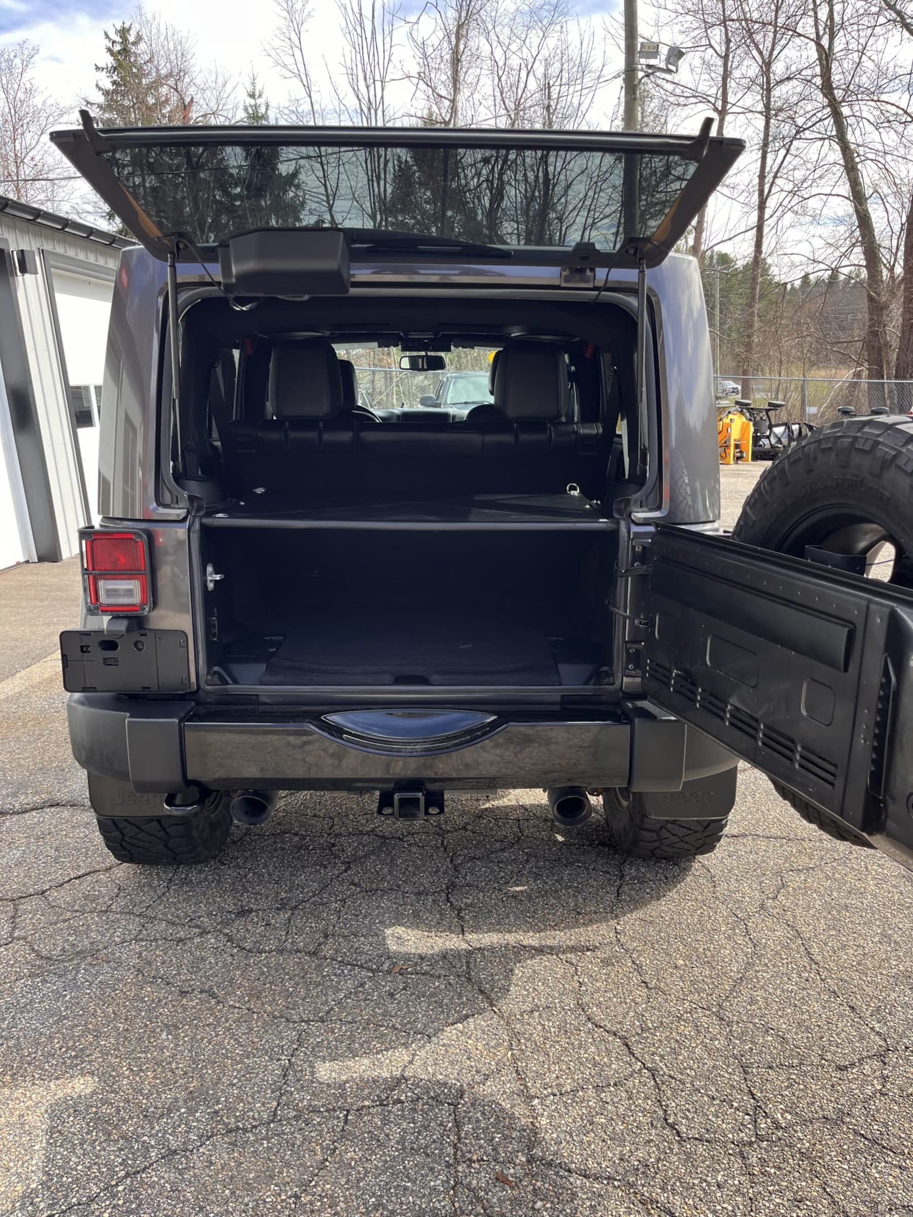 NEW ARRIVAL!! 2018 Jeep Unlimited Altitude!! Clean car fax! ONLY 43,800 miles!! Heated leather seats, lift, wheels and tires, backup camera, body color matching hard top, remote start and many extras!! Looks and runs great! Won’t last at $29,900!!