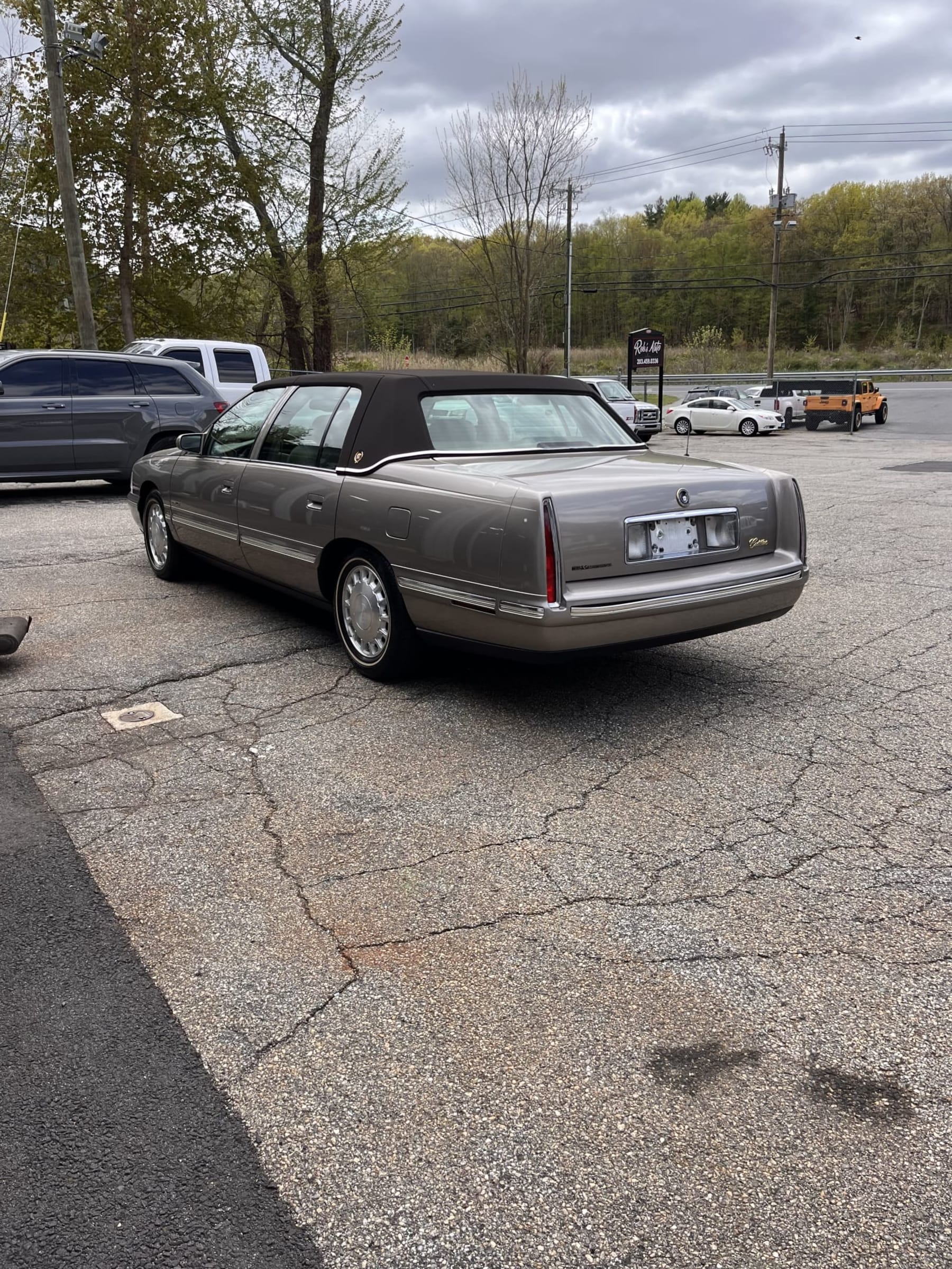 NEW ARRIVAL!! Looking for a diamond in the rough? Just in a 1999 Cadillac DeVille! 50 year golden anniversary edition!! ONLY 29,500 miles! Garaged its entire life! Runs and drives great!! Won’t last at $9,900!!