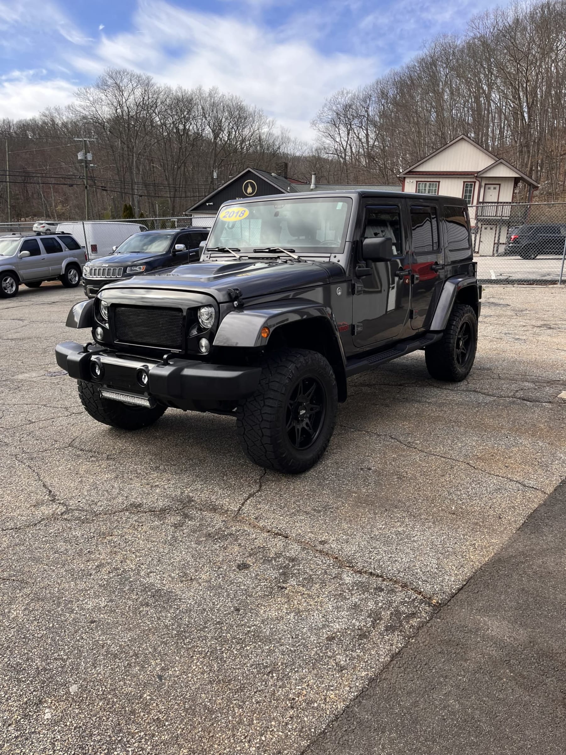 NEW ARRIVAL!! 2018 Jeep Unlimited Altitude!! Clean car fax! ONLY 43,800 miles!! Heated leather seats, lift, wheels and tires, backup camera, body color matching hard top, remote start and many extras!! Looks and runs great! Won’t last at $29,900!!
