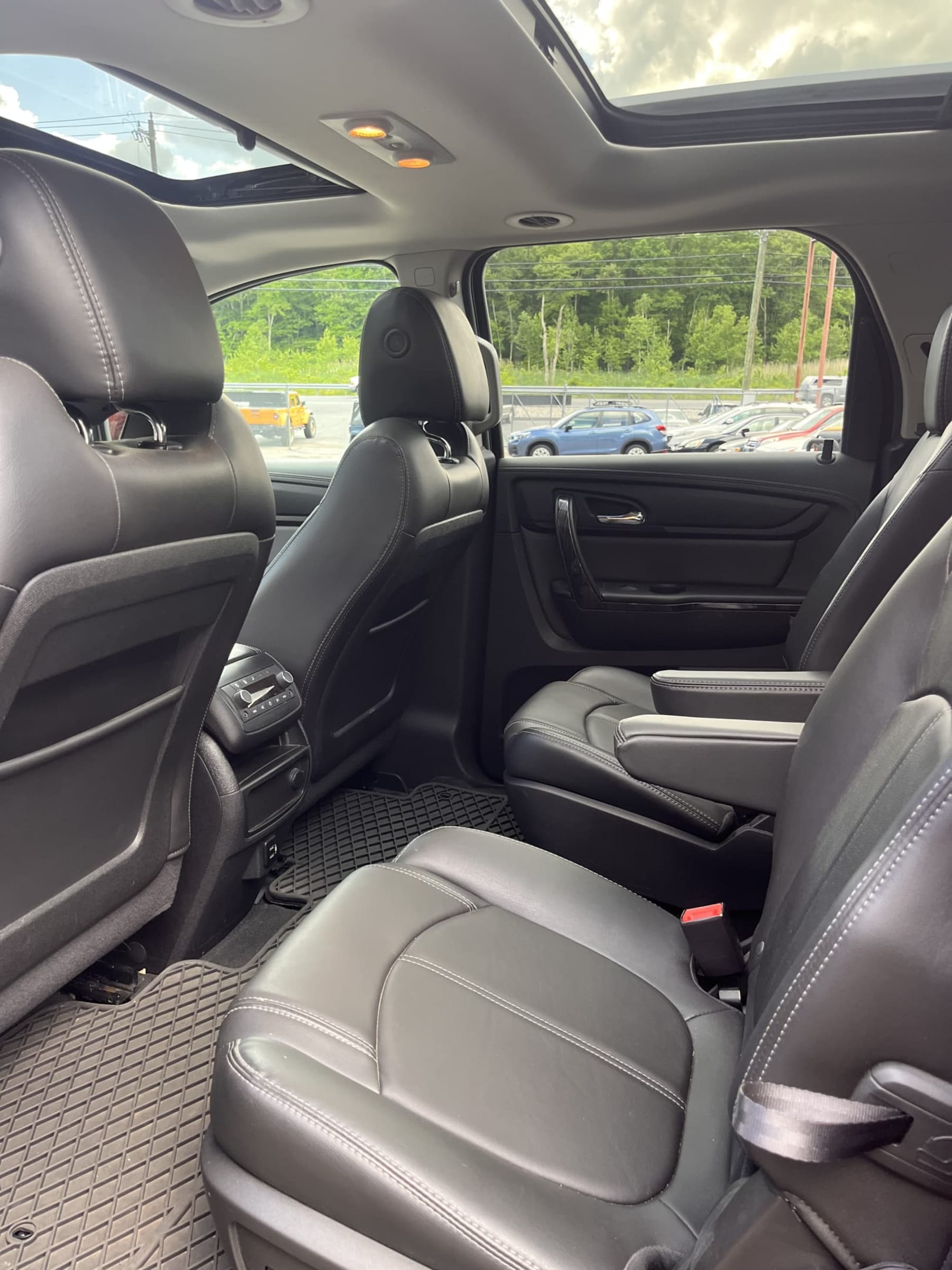 NEW ARRIVAL!! One owner 2017 GMC Acadia Limited! ONLY 77k miles! AWD!! Loaded with navigation, dual panel moonroof, heated leather seats, heated steering wheel, 2nd row captain chairs, third row, 20” wheels, remote start, heads up display and much much more!! Will not last at only $18,900!!