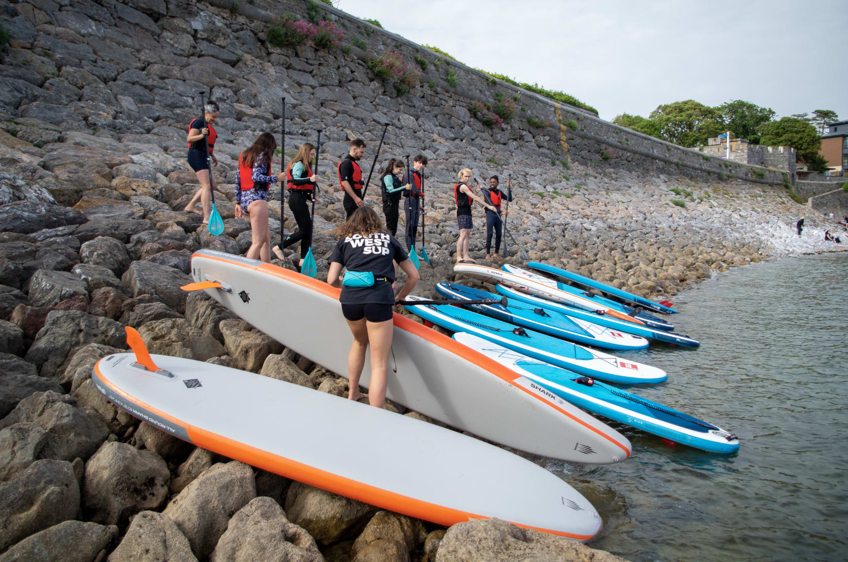 goodwith team enjoying paddle boarding