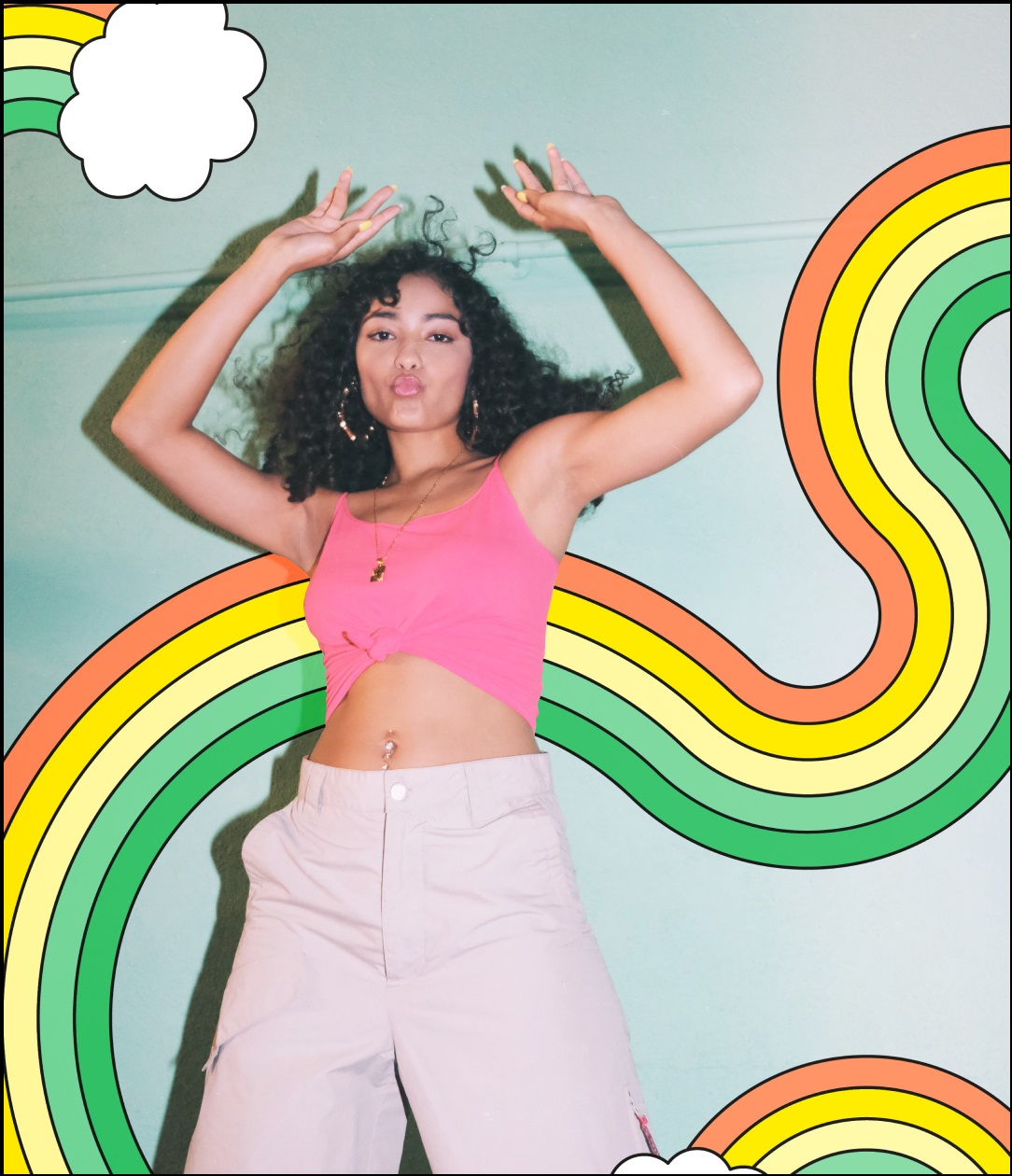 Woman dancing with rainbow background