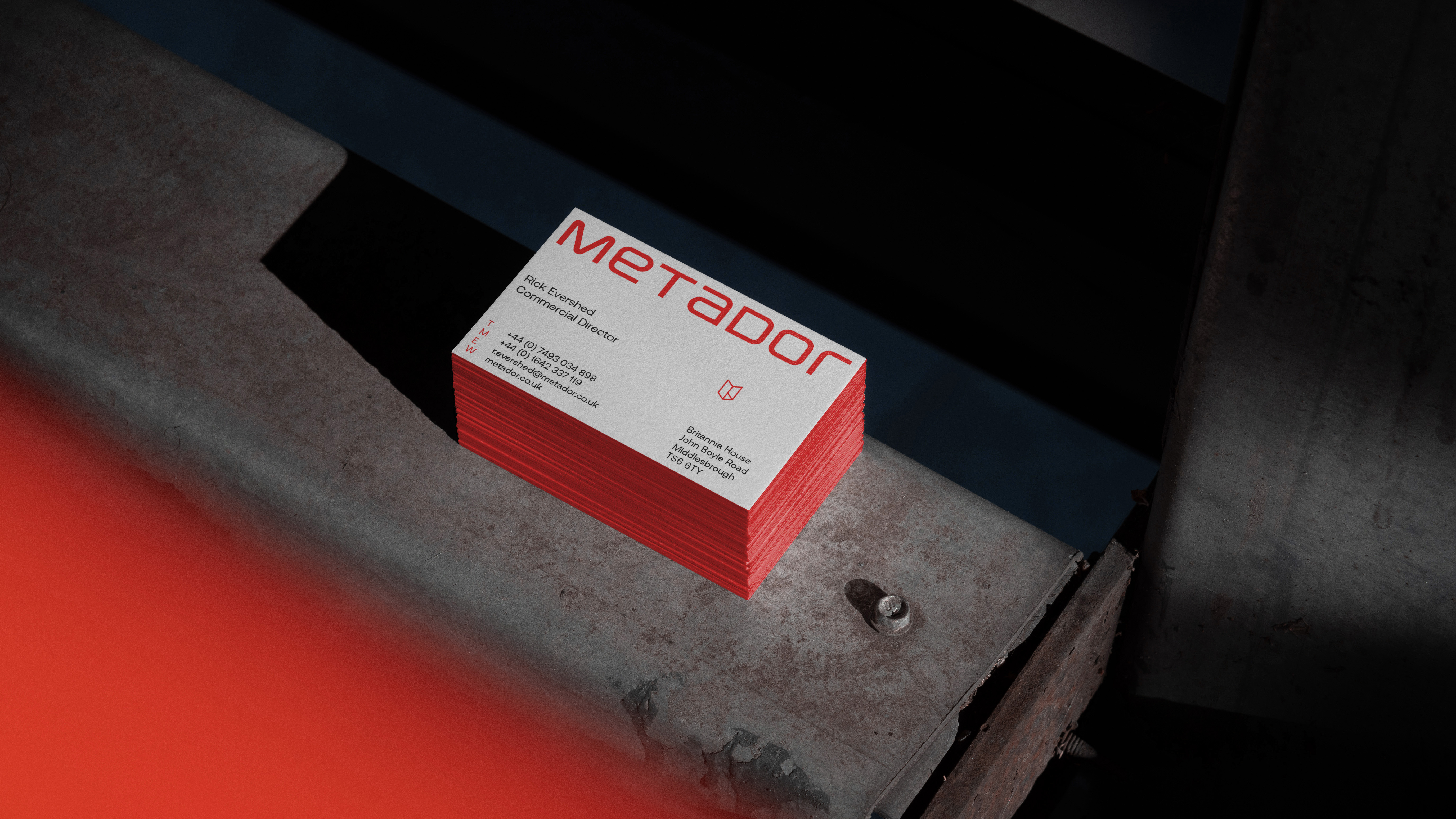 Rear design of the new Metador business cards against an industrial background