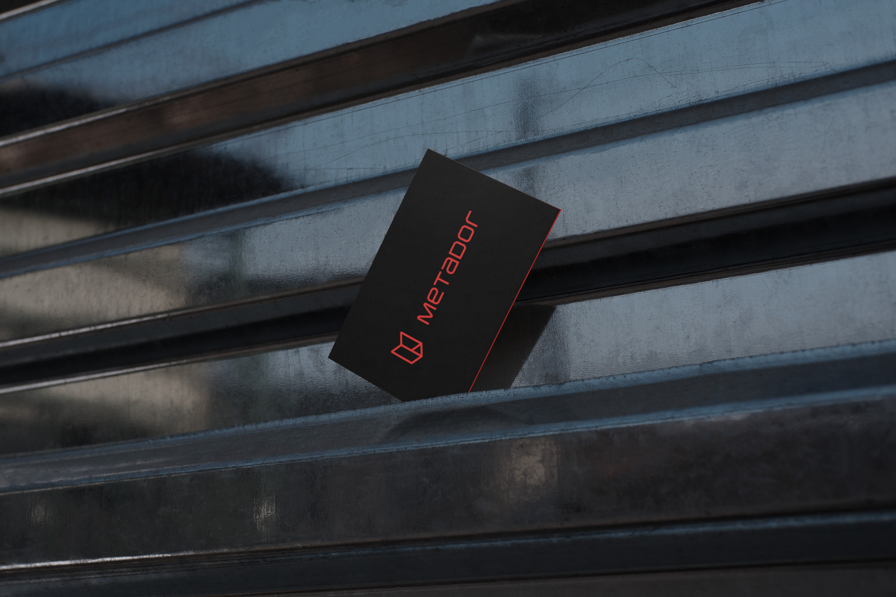 Front design of the new Metador business cards against an industrial background