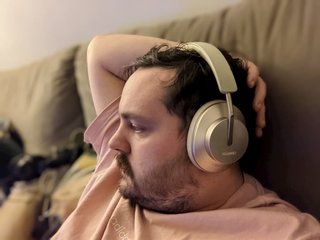 Gold Huawei headphones