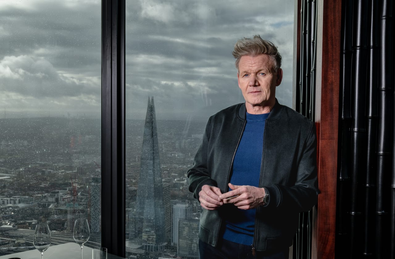 Gordon Ramsay against a window with views across London