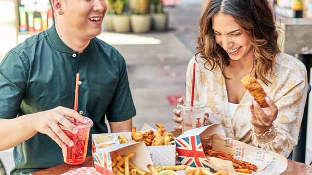 Couple with assortment of combos, fries and drink