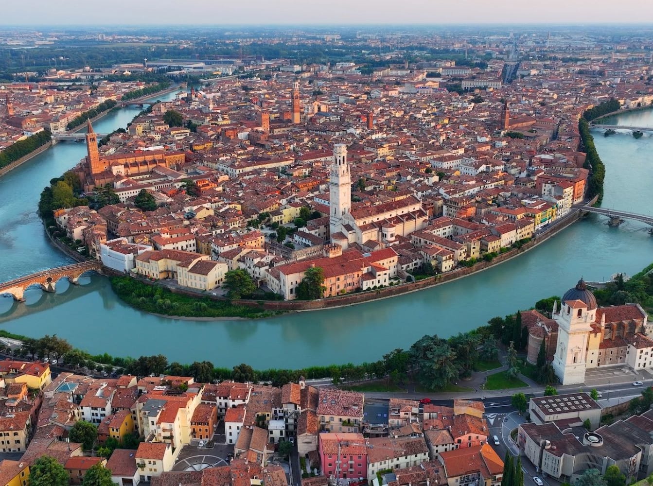 aerial view of verona and river curving around the city