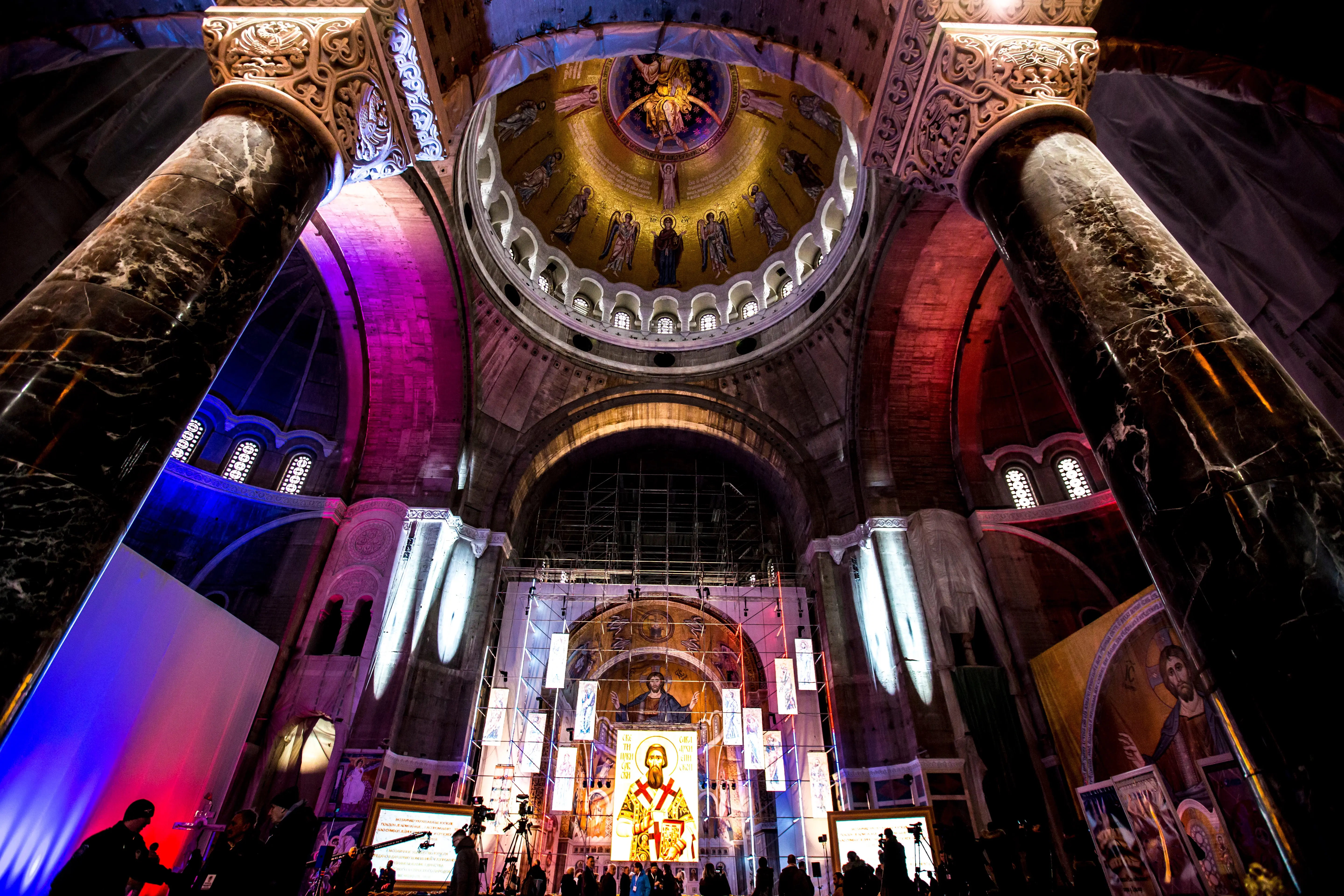 An Old Church Lit Up Inside with Colorful Lights