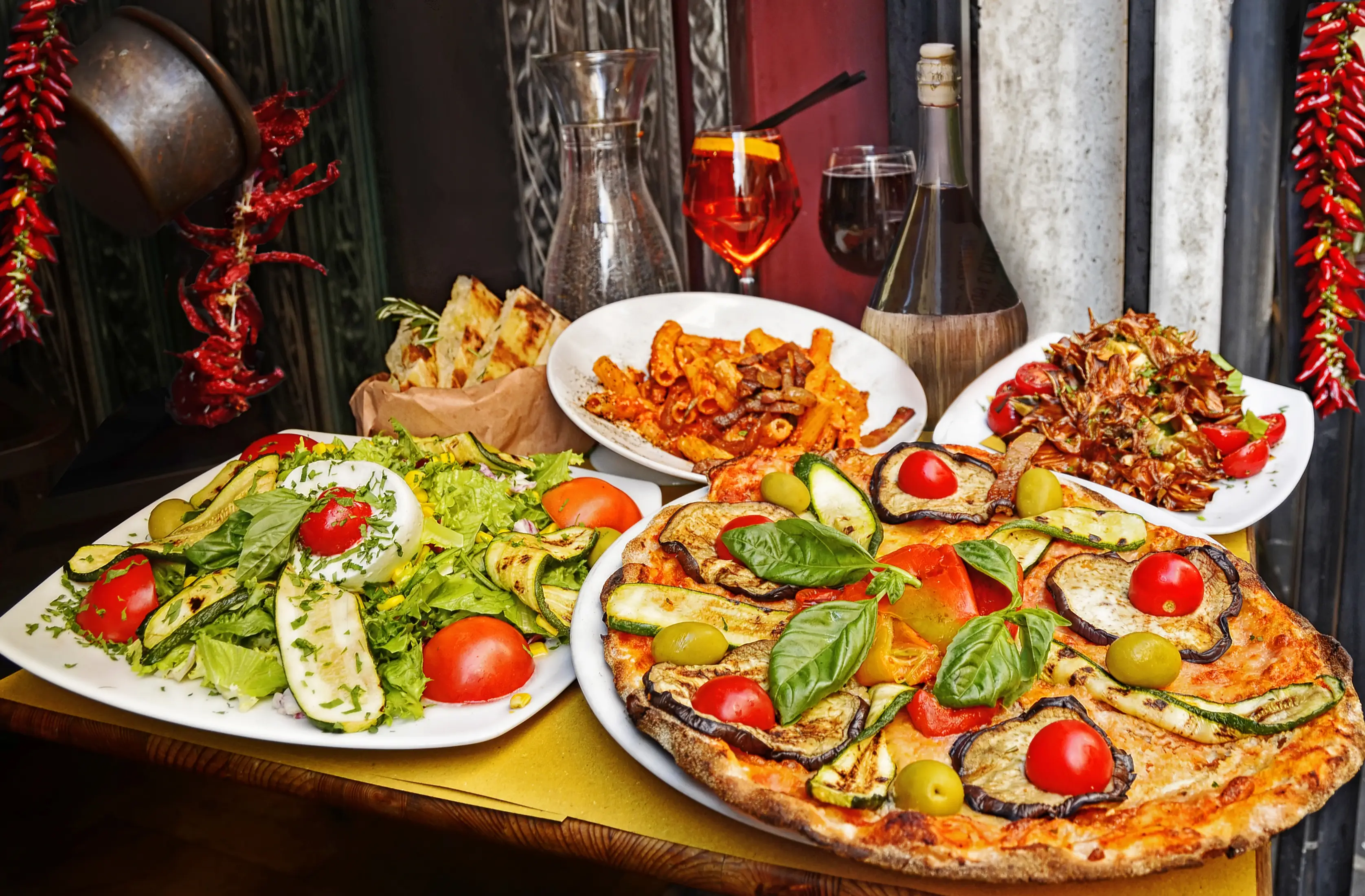 Eggplant Pizza Salad and Pasta at a Restaurant in Rome