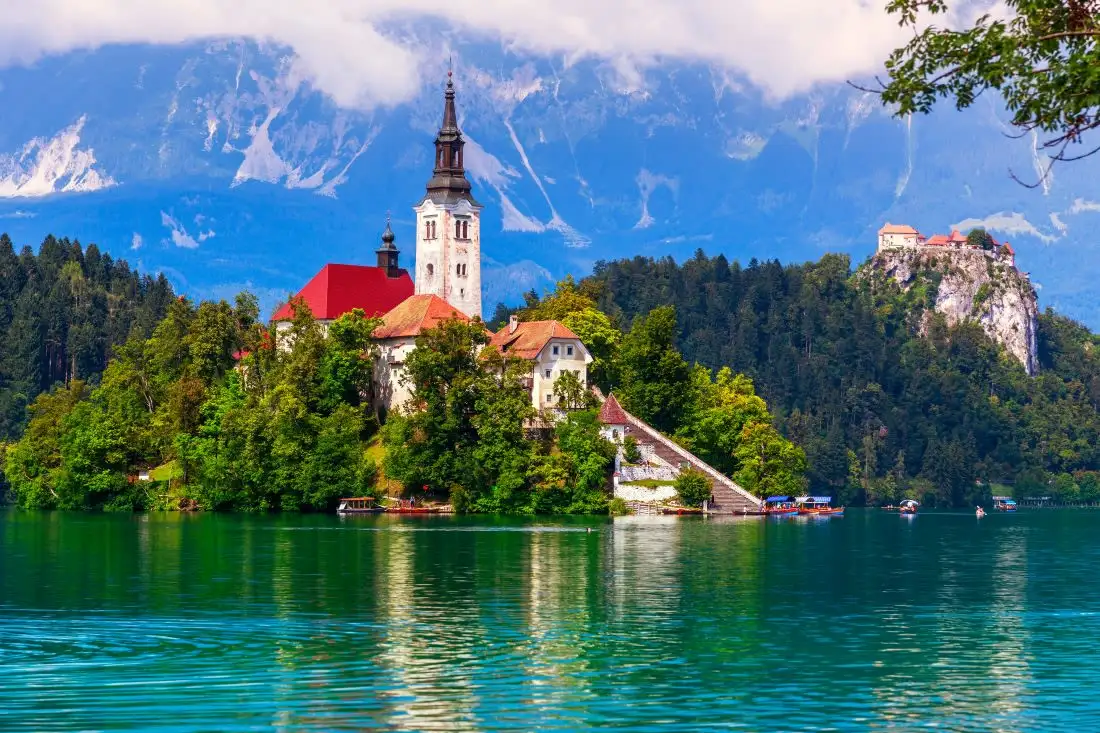 view of church of the mother of god with castle behind