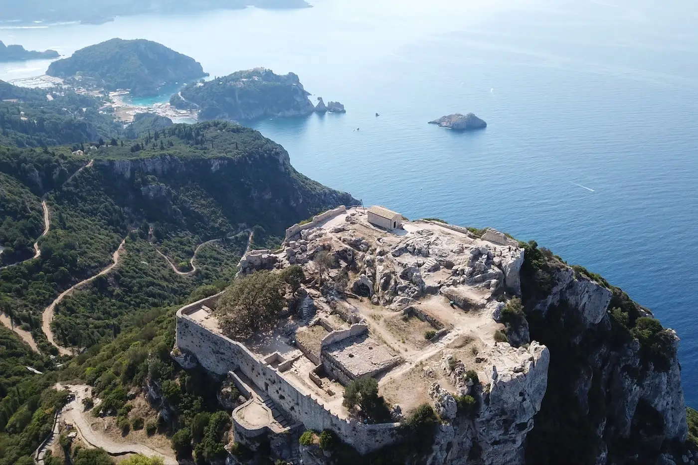 Aerial view of Angelokastro fortress and Paleokastritsa below