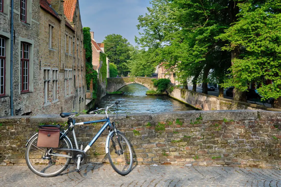 bike on bridge of narrow canal