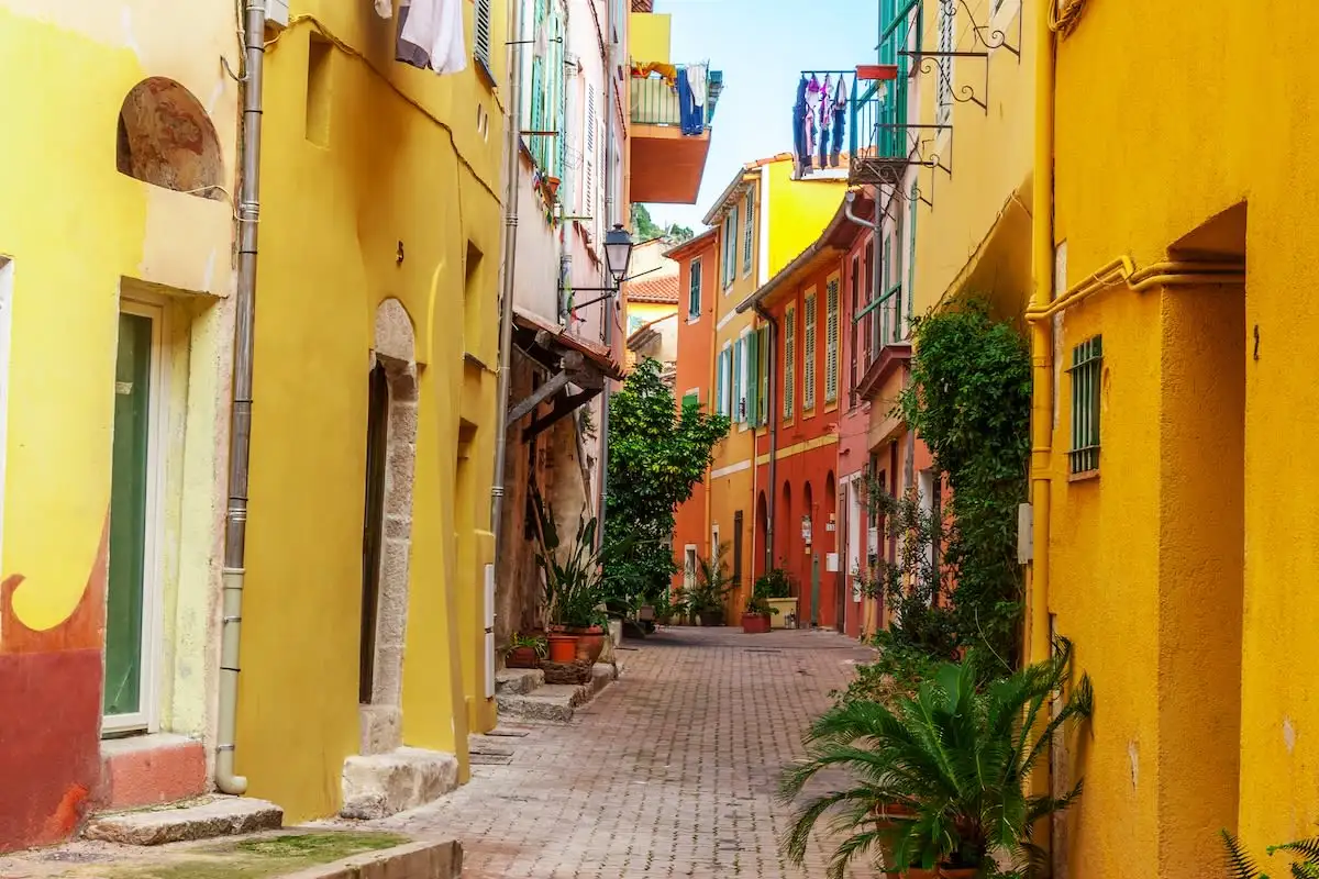 Small lane between colorful buildings in Nice France