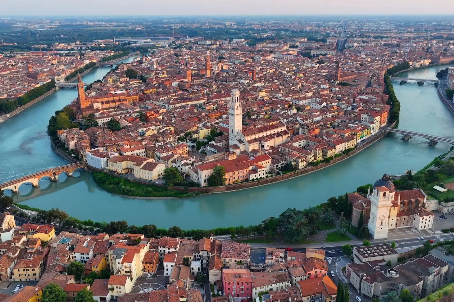 aerial view of verona and river curving around the city