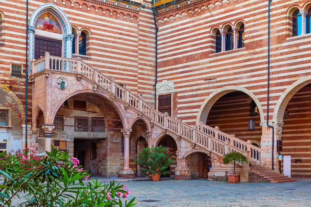 Historic marble staircase Scala della Ragione inside the courtyard of Palazzo della Ragione in Verona