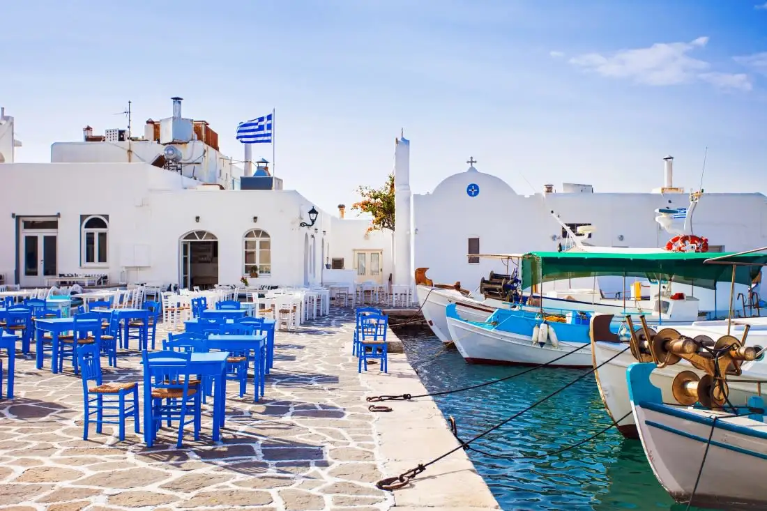 restaurant seating next to port with boats