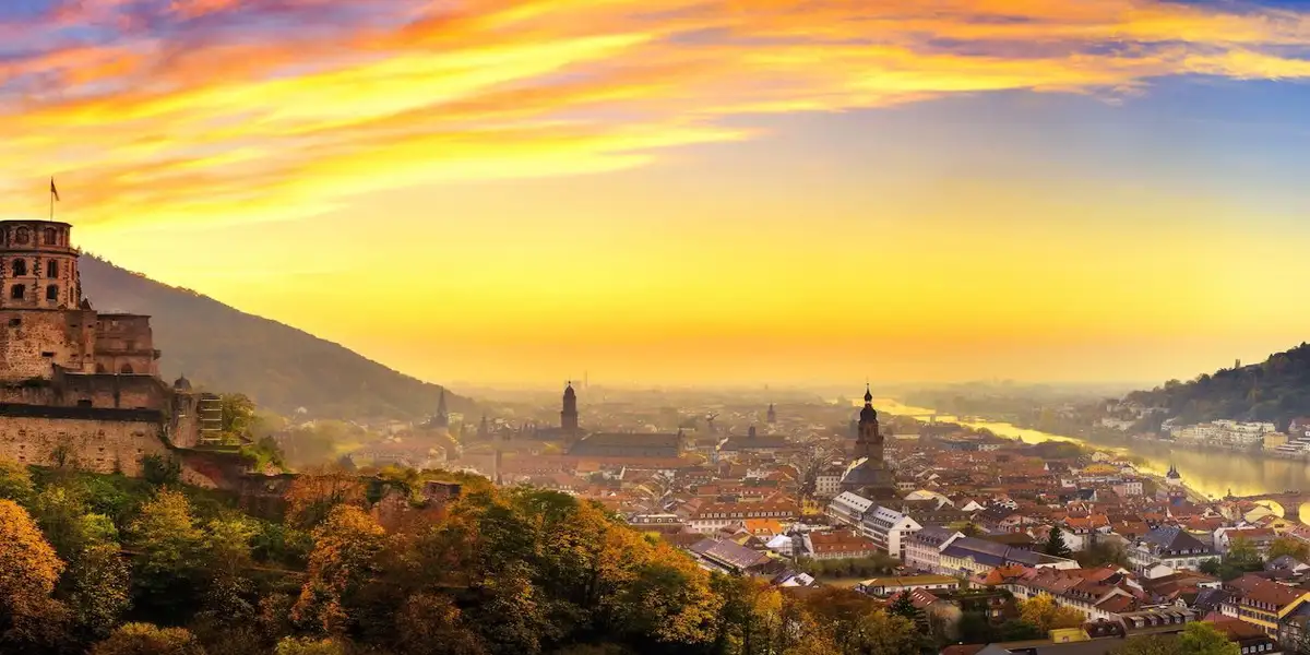A view of Heidelberg's Castle and Old Town at sunset