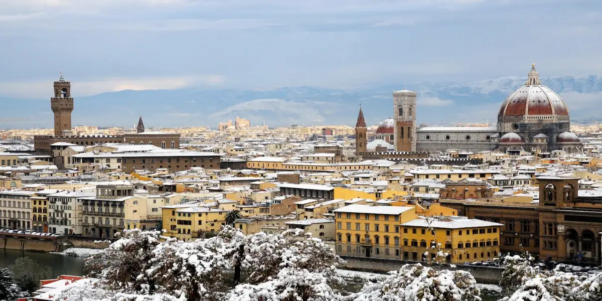 View of the Duomo and Florence's historic skyline in winter dusted by a coat of snow