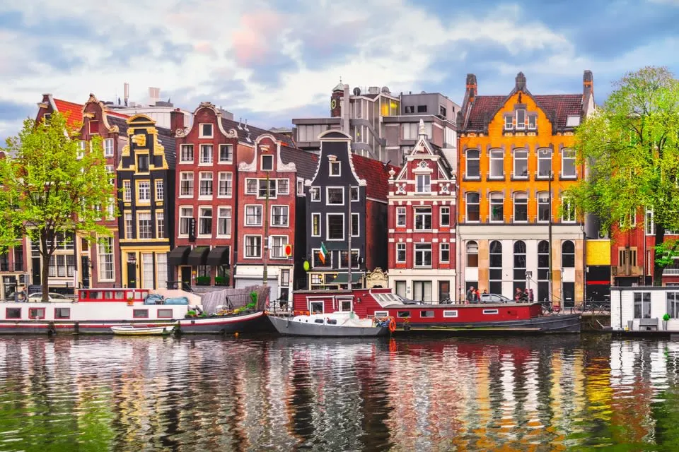 Gabled houses in Amsterdam next to a canal