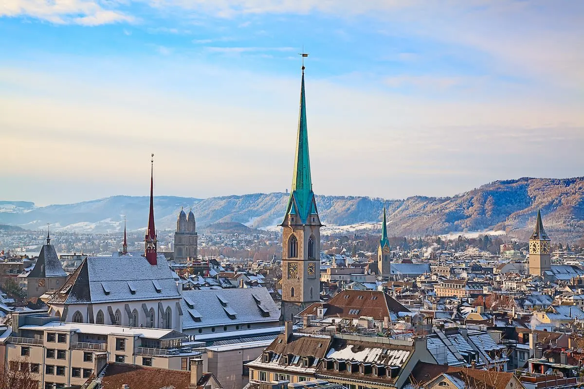 The center of Zurich in winter under a light snowfall