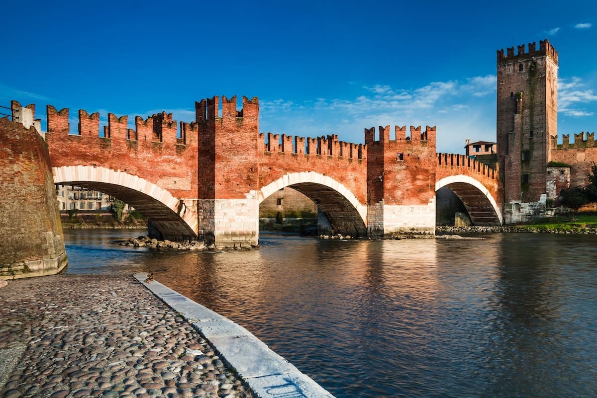 Castelvecchio and Ponte Scaligero by river in verona italy