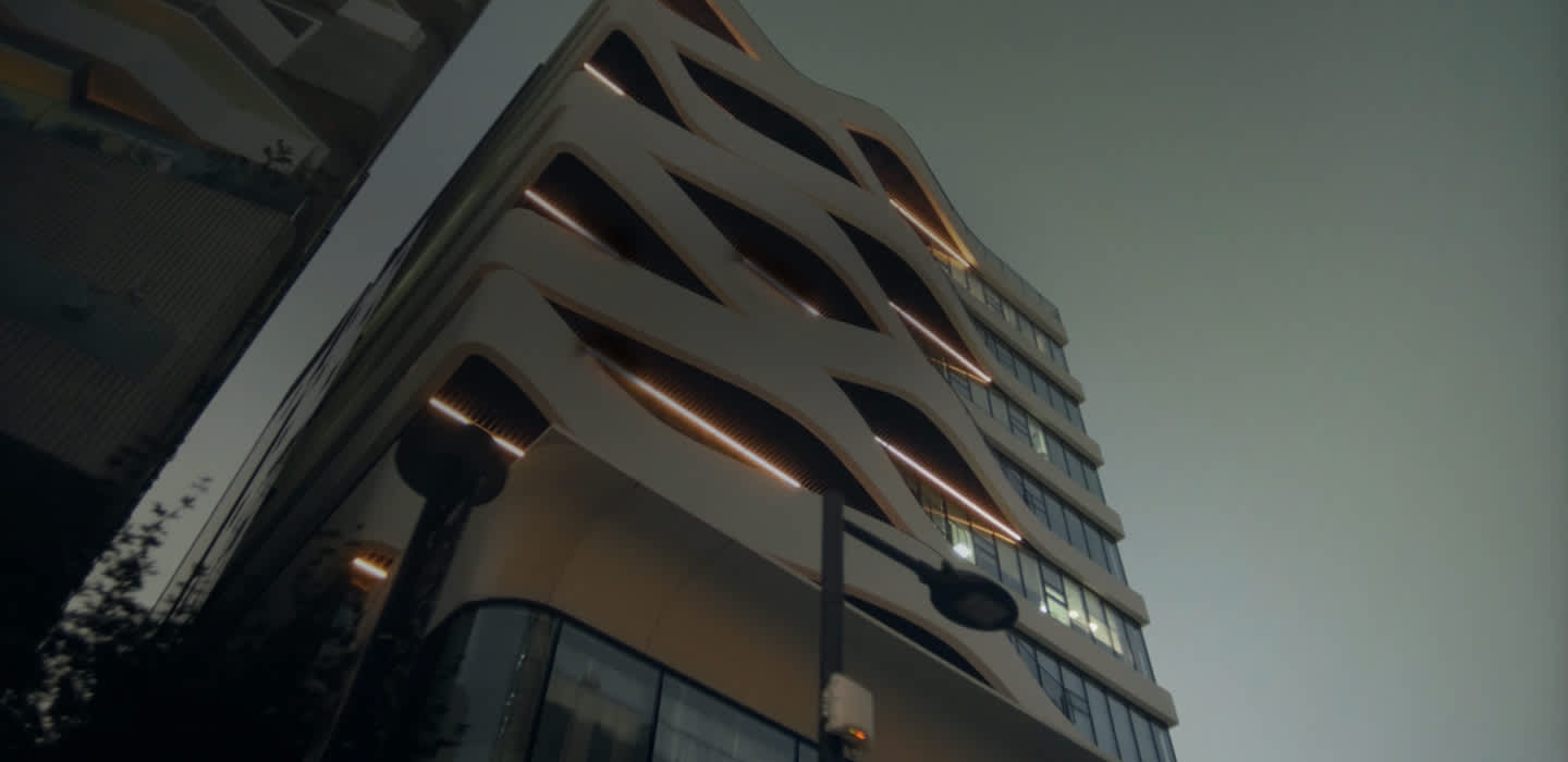 A view of the Factorial Seongsu office building from below looking up at the modern exterior.