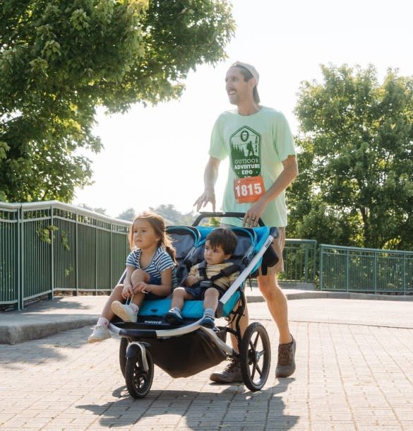 Father pushing a running stroller