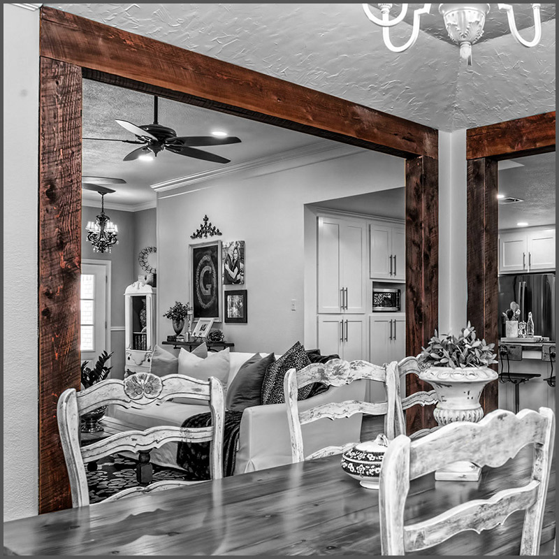 Circle sawn Eastern Red Cedar beams hold up a threshold in Waco, Tx.