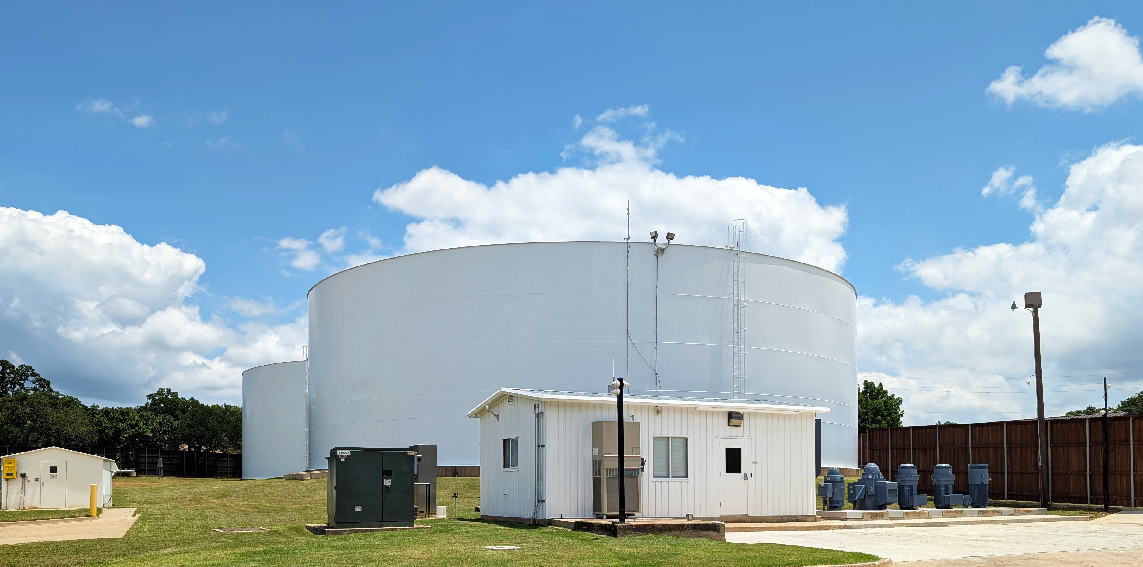 Pump Station image showing two ground water tanks, five pumps, and pump house