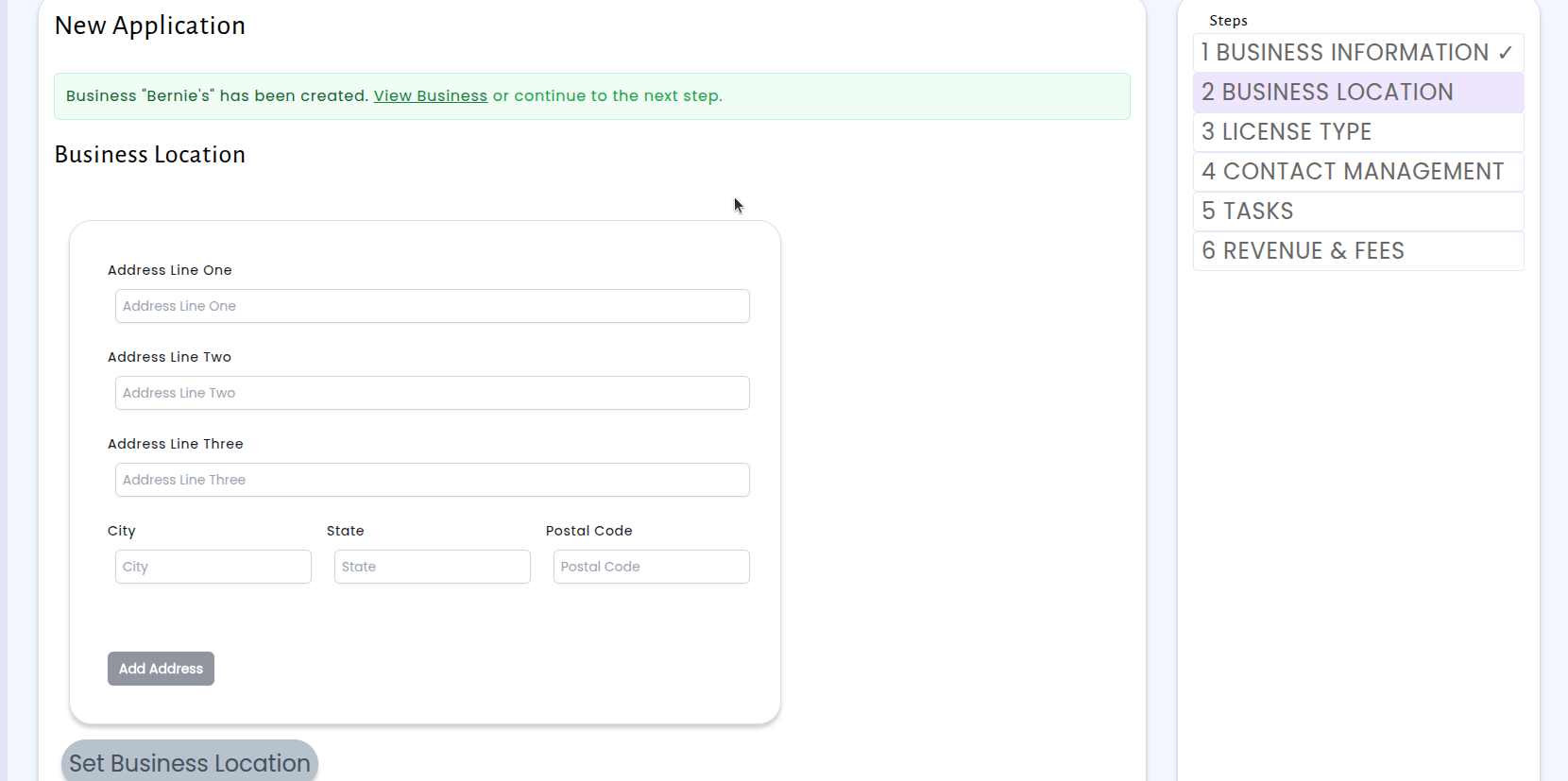 Step 2: Business Location with address fields and a confirmation banner showing the business was created