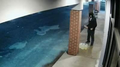 Video shows man with jugs of gasoline lighting Inkster strip mall on fire