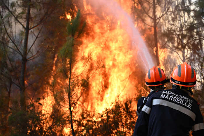 FILE - Firefighters battle a forest fire near Blagon during wildfires in southwestern France, July 29, 2026. (AP Photo/Emma Da Silva, File)