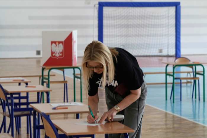Poland on a knife’s edge as exit polls show a near tie in presidential runoff