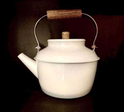 vintage enamel kettle On the wood-burning stove in the morning