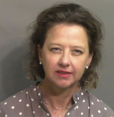 FILE - This jail booking photo provided by Glynn County Sheriff's Office, shows Jackie Johnson, the former district attorney for Georgia's Brunswick Judicial Circuit, after she turned herself in to the Glynn County jail in Brunswick, Ga, on Wednesday, Sept. 8, 2021.   One of the men convicted of murder in the street chase and fatal shooting of Ahmaud Arbery spoke with Johnson, his former boss, the local district attorney, several times by phone in the days and weeks following the 2020 killing, according to a court document filed Thursday, May 4, 2022.(Glynn County Sheriff's Office via AP, File)